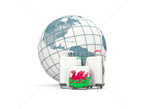 Luggage with flag of wales. Three bags in front of globe Stock photo © MikhailMishchenko