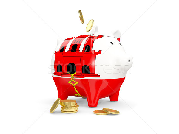 Fat piggy bank with fag of gibraltar Stock photo © MikhailMishchenko
