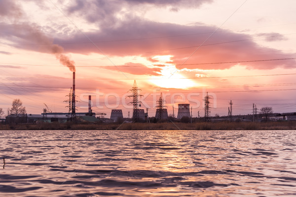 Stock photo: Thermal power plant reflecting in the lake
