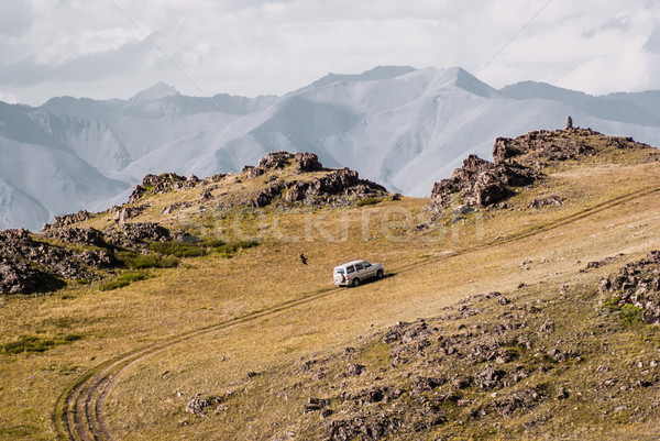 Stock photo: Car rides on top of the mountain. Alpine scenery at Altai Mounta