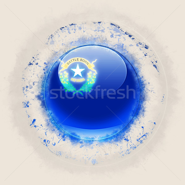 nevada state flag on a round grunge icon. United states local fl Stock photo © MikhailMishchenko