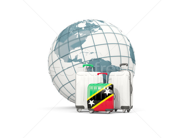 Luggage with flag of saint kitts and nevis. Three bags in front  Stock photo © MikhailMishchenko