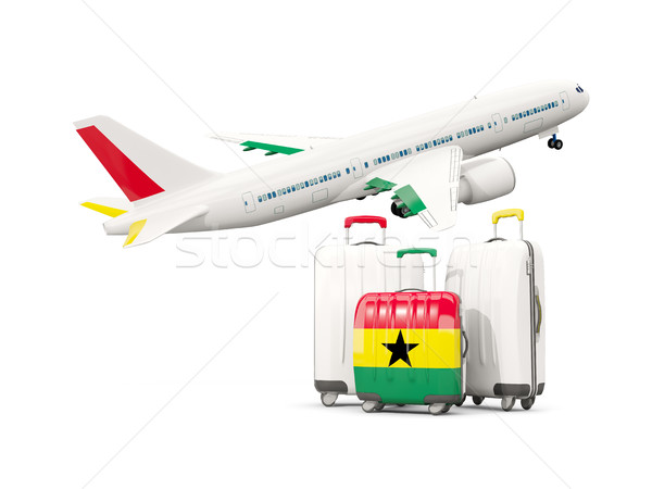 Luggage with flag of ghana. Three bags with airplane Stock photo © MikhailMishchenko