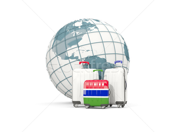 Luggage with flag of gambia. Three bags in front of globe Stock photo © MikhailMishchenko