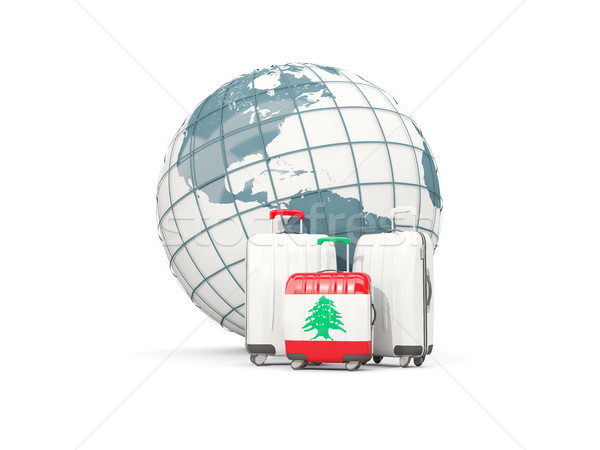 Luggage with flag of lebanon. Three bags in front of globe Stock photo © MikhailMishchenko