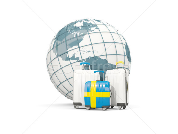 Luggage with flag of sweden. Three bags in front of globe Stock photo © MikhailMishchenko