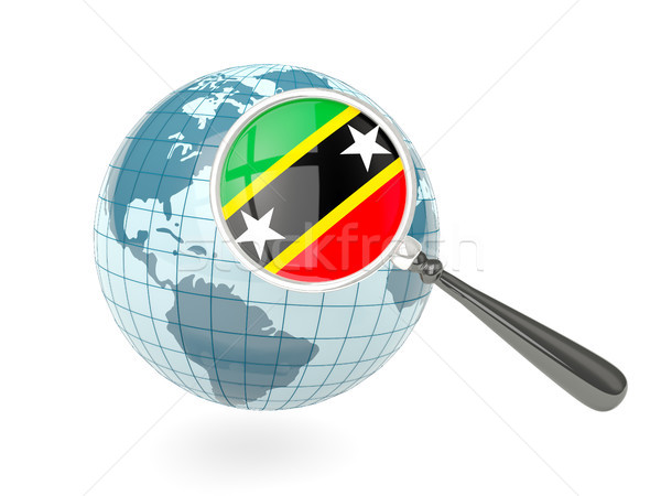 Magnified flag of saint kitts and nevis with blue globe Stock photo © MikhailMishchenko