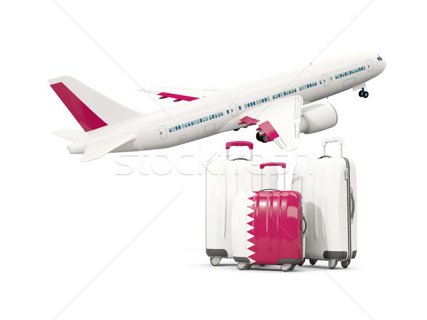 Luggage with flag of qatar. Three bags with airplane Stock photo © MikhailMishchenko