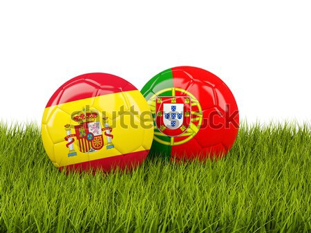 Two footballs with flags of Russia and Portugal on green grass Stock photo © MikhailMishchenko