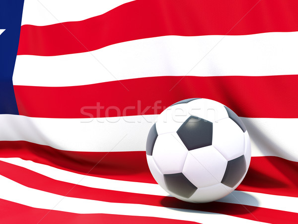 Flag of liberia with football in front of it Stock photo © MikhailMishchenko