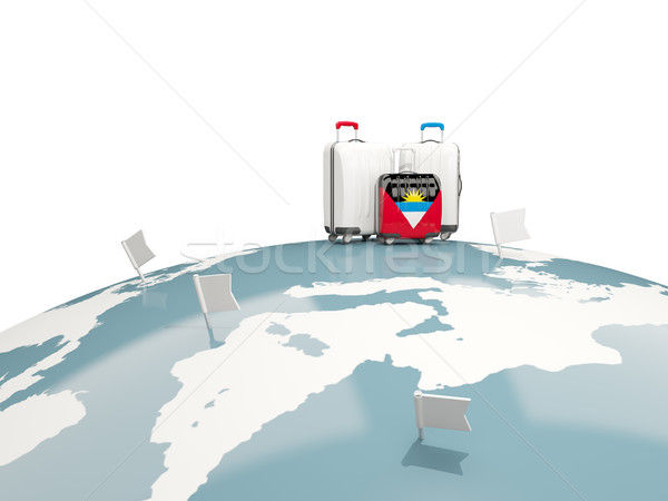 Luggage with flag of antigua and barbuda. Three bags on top of g Stock photo © MikhailMishchenko