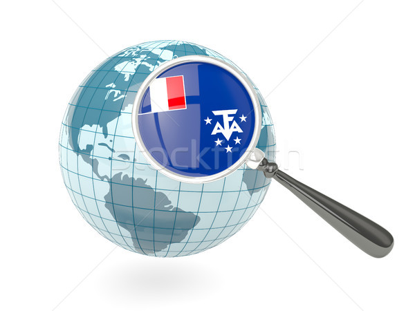 Magnified flag of french southern territories with blue globe Stock photo © MikhailMishchenko