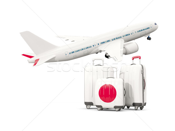 Stock photo: Luggage with flag of japan. Three bags with airplane