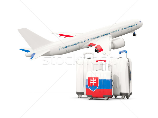 Luggage with flag of slovakia. Three bags with airplane Stock photo © MikhailMishchenko