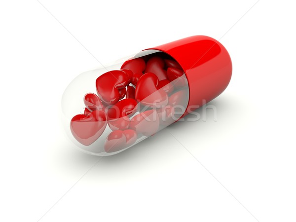 Pill with hearts inside Stock photo © MikhailMishchenko