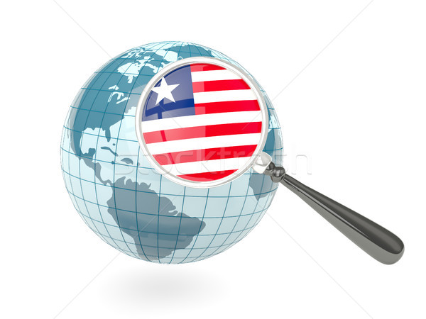 Magnified flag of liberia with blue globe Stock photo © MikhailMishchenko