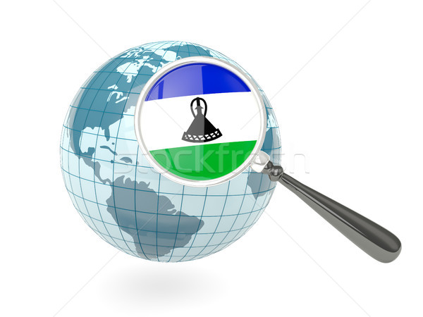 Magnified flag of lesotho with blue globe Stock photo © MikhailMishchenko