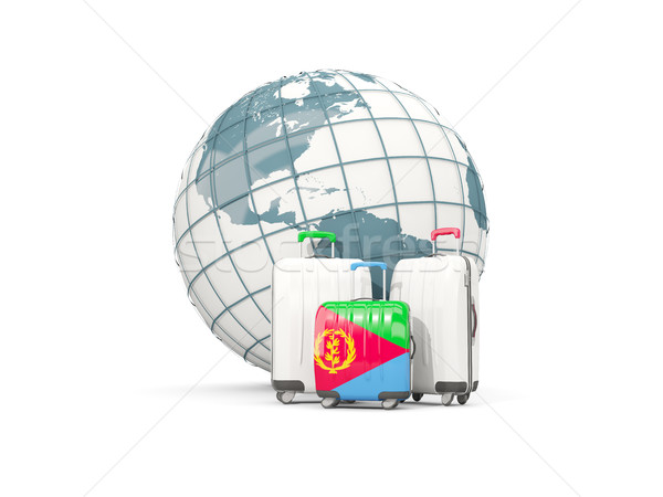 Luggage with flag of eritrea. Three bags in front of globe Stock photo © MikhailMishchenko
