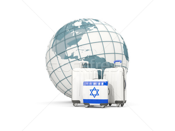 Luggage with flag of israel. Three bags in front of globe Stock photo © MikhailMishchenko