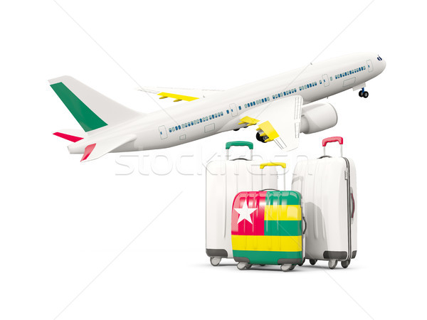 Luggage with flag of togo. Three bags with airplane Stock photo © MikhailMishchenko