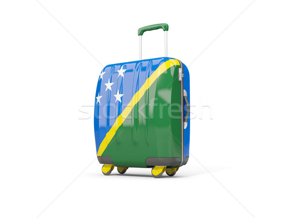 Luggage with flag of solomon islands. Suitcase isolated on white Stock photo © MikhailMishchenko