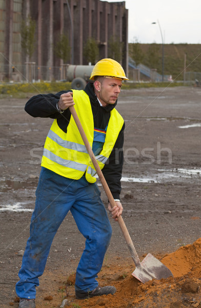 Construction worker digging ground Stock photo © MikLav