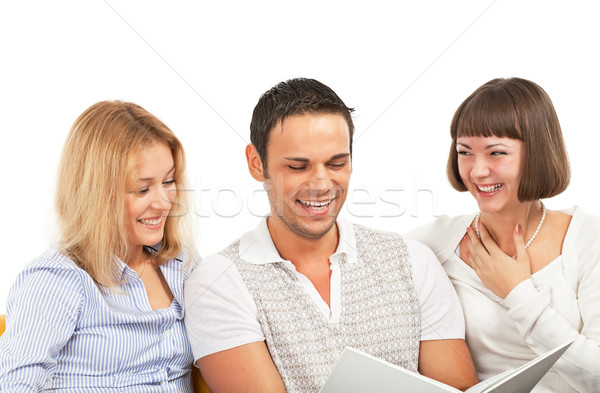 Amused young people with book Stock photo © MikLav