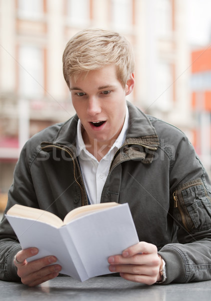 Young guy with book Stock photo © MikLav