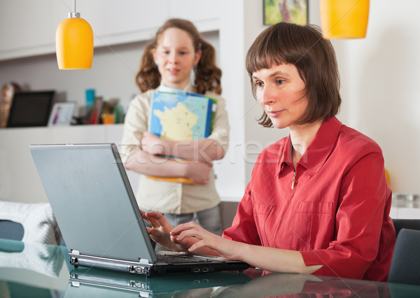 Mom and daughter at home with laptop Stock photo © MikLav