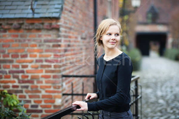 Pretty young woman on medieval street Stock photo © MikLav