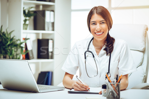 Smiling Female Young Doctor  Stock photo © MilanMarkovic78