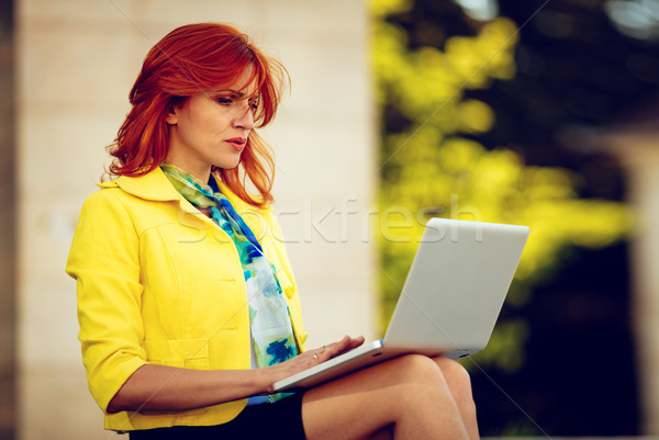 Businesswoman Working At The Laptop Stock photo © MilanMarkovic78