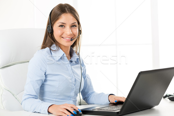  Bussineswoman With A Headphone, Typing On The Laptop  Stock photo © MilanMarkovic78