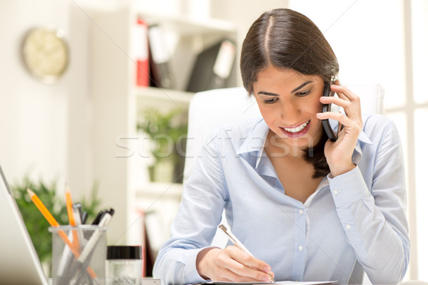 Happy Businesswoman Phoning Stock photo © MilanMarkovic78