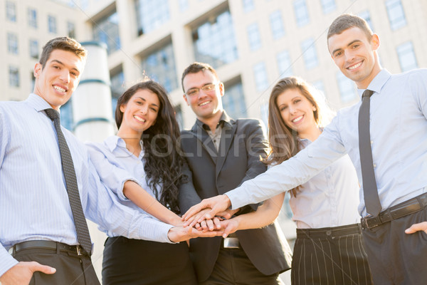 Motivação negócio pequeno grupo jovem pessoas de negócios em pé Foto stock © MilanMarkovic78