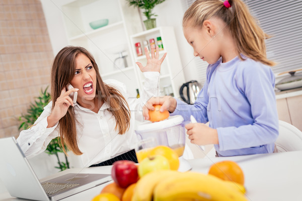 Stressed Businesswoman And Her Daughter In The Morning At Home Stock photo © MilanMarkovic78