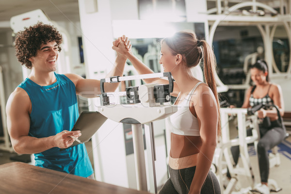 Coach With Female Client At The Gym Stock photo © MilanMarkovic78