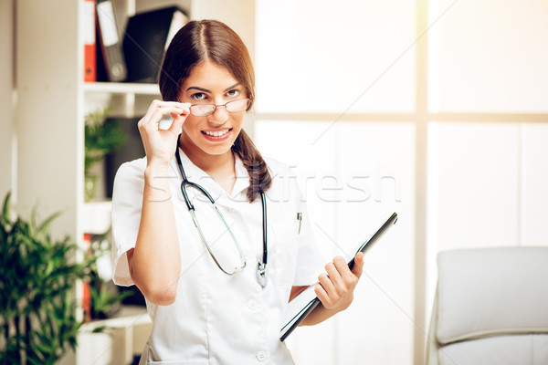 Successful Female Young Doctor  Stock photo © MilanMarkovic78