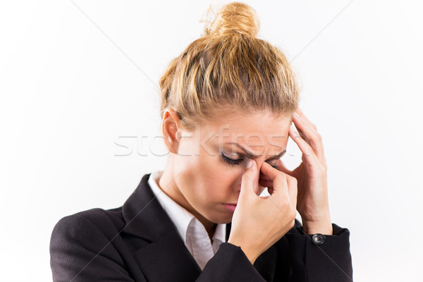Businesswoman with a headache Stock photo © MilanMarkovic78