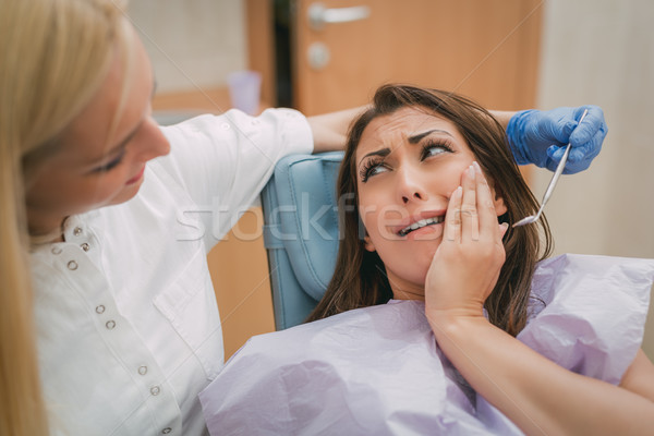 Ból zęba piękna młoda kobieta wizyta posiedzenia Zdjęcia stock © MilanMarkovic78