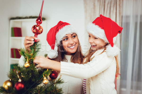 Stock photo: Decorating Christmas Tree