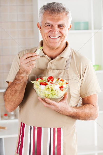 Senior man in the kitchen Stock photo © MilanMarkovic78