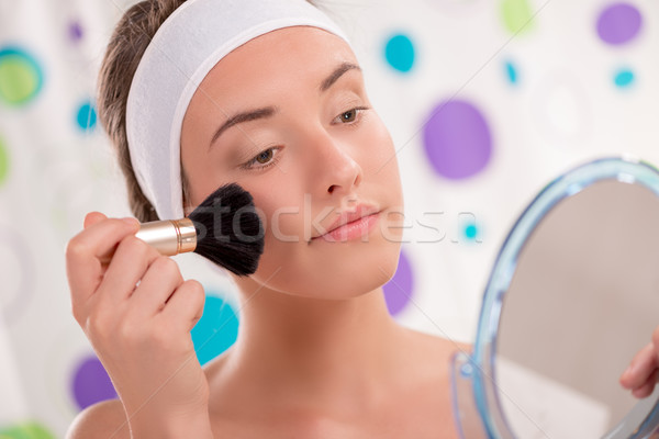 Cute Girl Applying Blush Stock photo © MilanMarkovic78