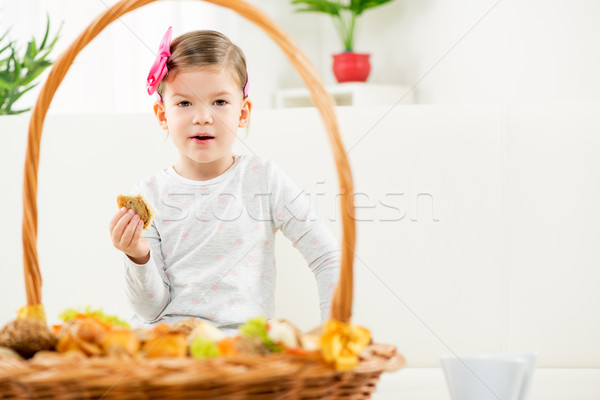 A Little Girl Eating Baked Products Stock photo © MilanMarkovic78