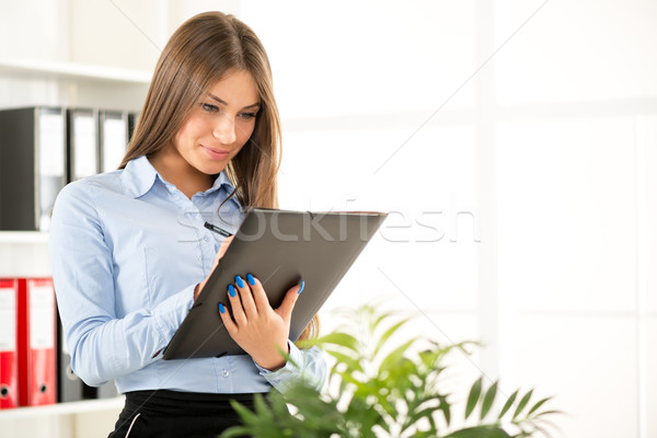 Young Businesswoman With Folder Stock photo © MilanMarkovic78