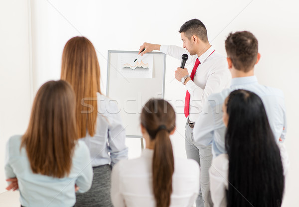 Stock photo: Businessman Pointing Flip Chart