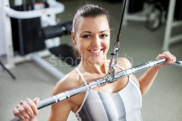 Young woman exercising back muscles Stock photo © MilanMarkovic78