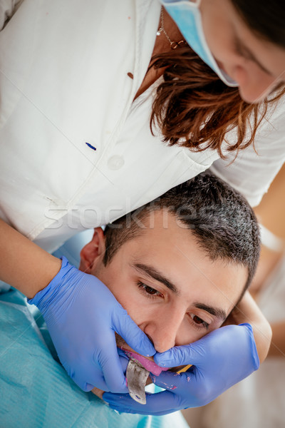 Dişçi diş izlenim pantolon askısı erkek hasta Stok fotoğraf © MilanMarkovic78