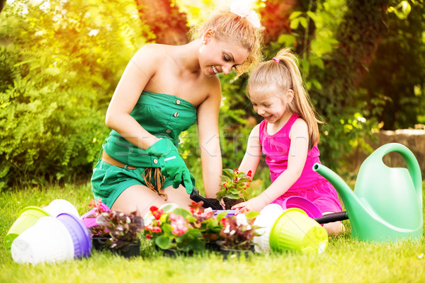 Mother and Daughter Planting Flowers Together Stock photo © MilanMarkovic78