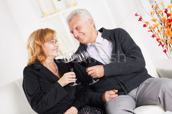 Pareja de ancianos feliz sesión junto casa sonriendo Foto stock © MilanMarkovic78